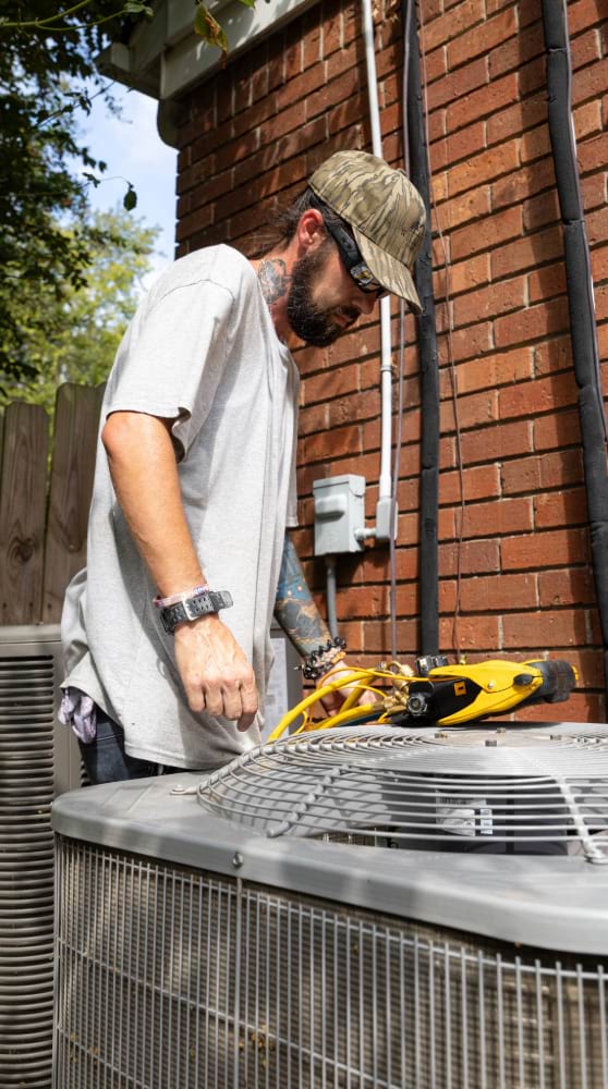Williams services worker testing an HVAC unit